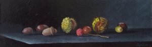 A realistic still life in oil of a litchi amidst chestnuts and acorns.